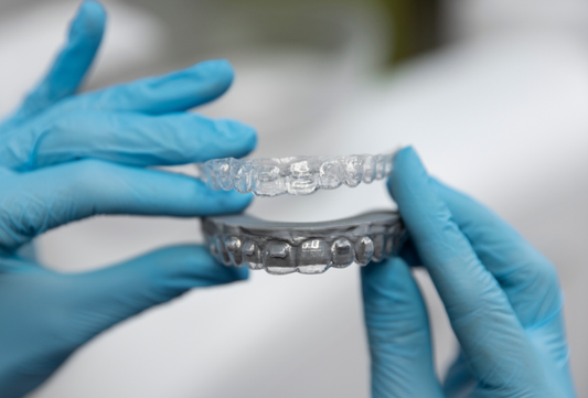 Clear aligner trays shown as modern alternatives to braces for teeth straightening.